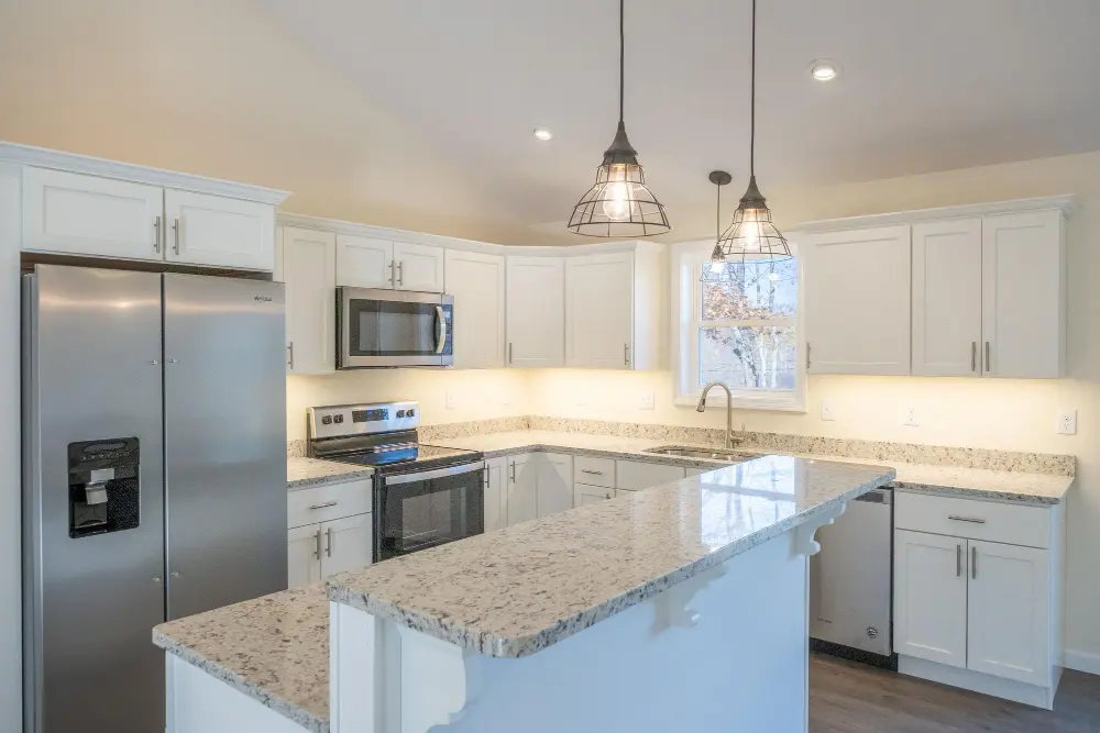Kitchen remodel with granite countertops and pendant lighting in Des Moines